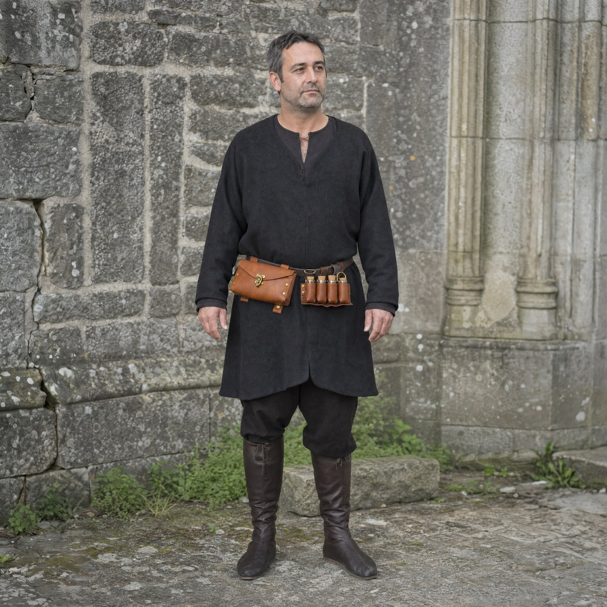 Brown belt pouch with four potion vials worn outdoors, full-length front view