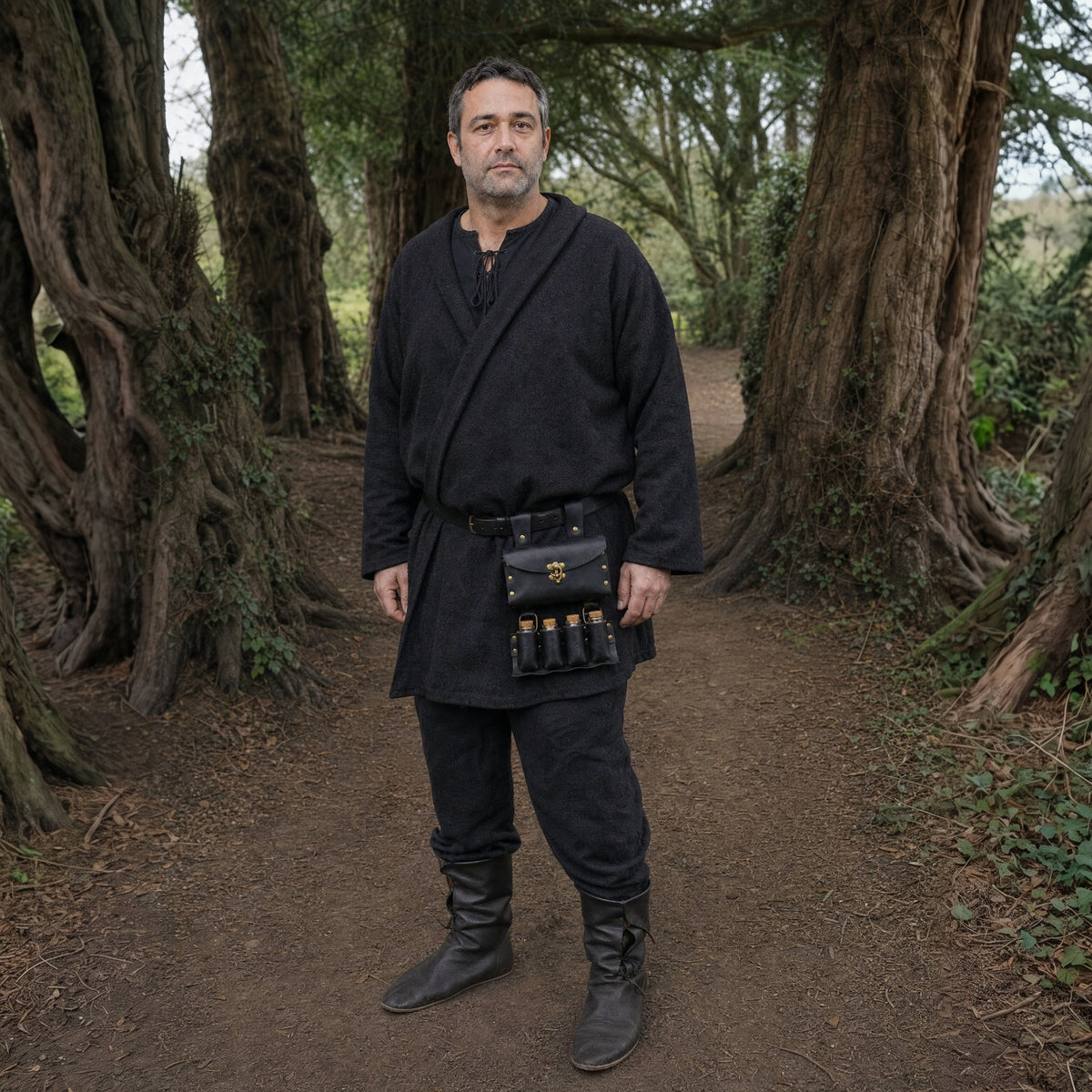 Black belt with pouch and potion vials worn outdoors, full-length front view