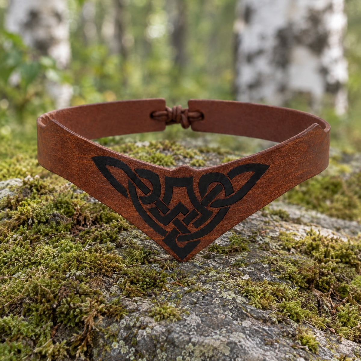 Brown thin celtic knotwork headband on a rustic surface