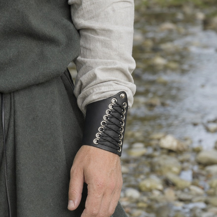 Centre-laced wrist cuff on a wrist, showing its short 10 cm length