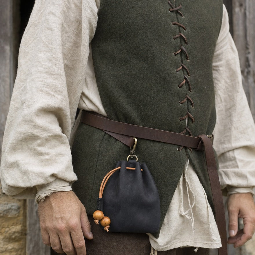 Clip-on leather drawstring pouch at a wearer's hip, showing its 11.5 cm height