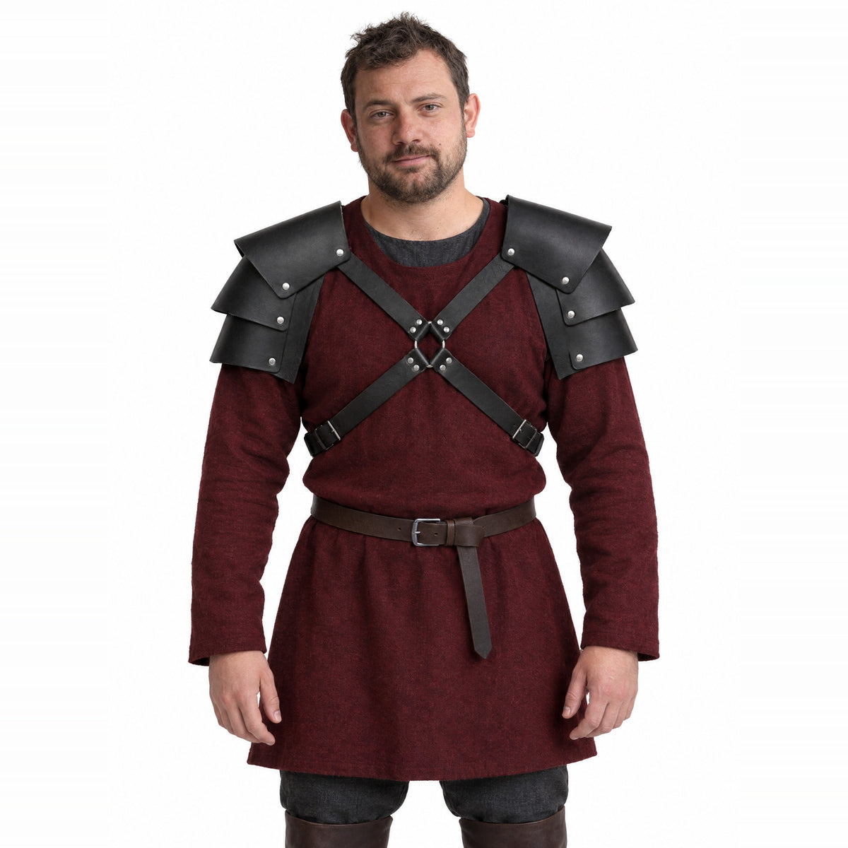 Black double pauldrons with cross straps worn by a model on a white background