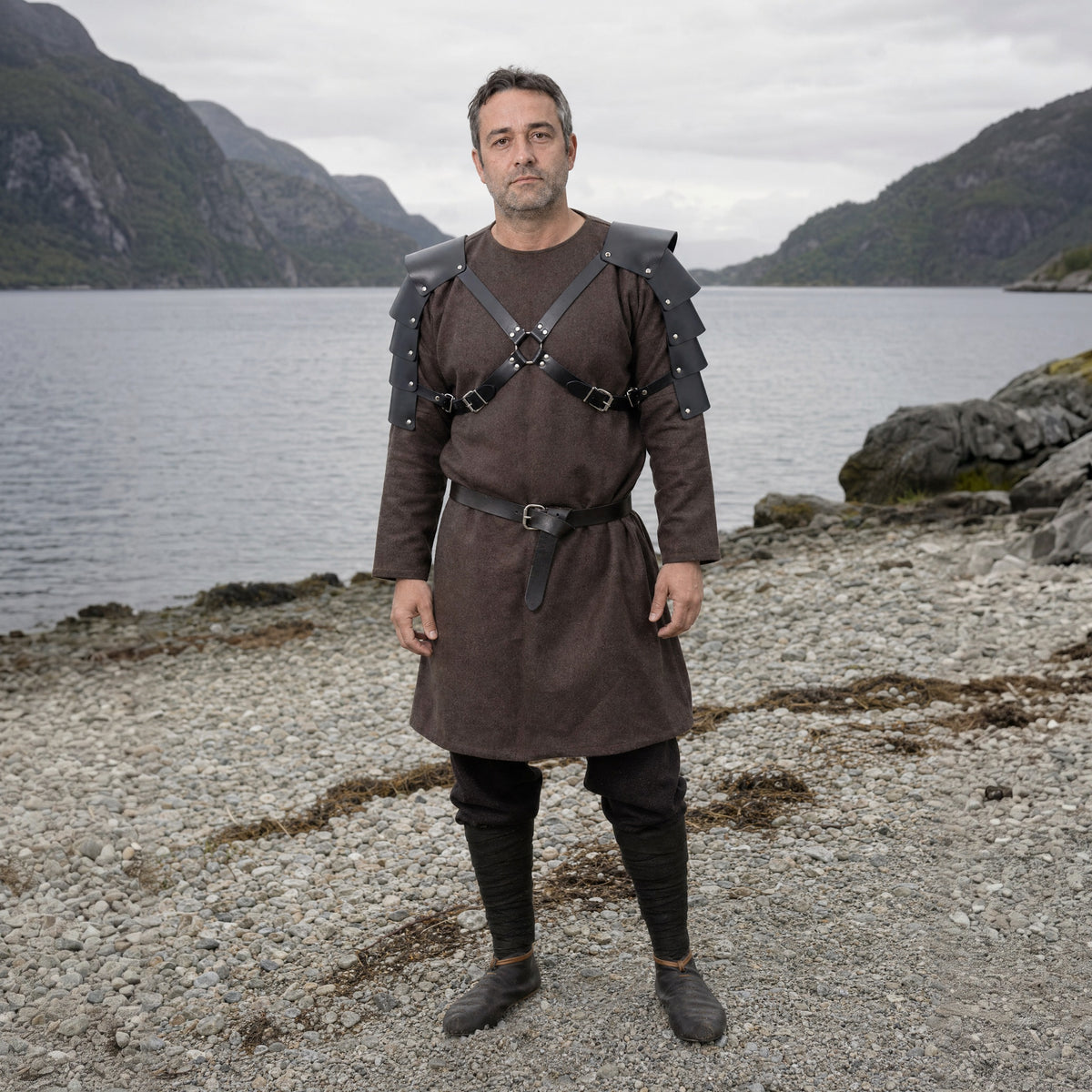 Black double pauldrons with cross straps worn outdoors, full-length front view