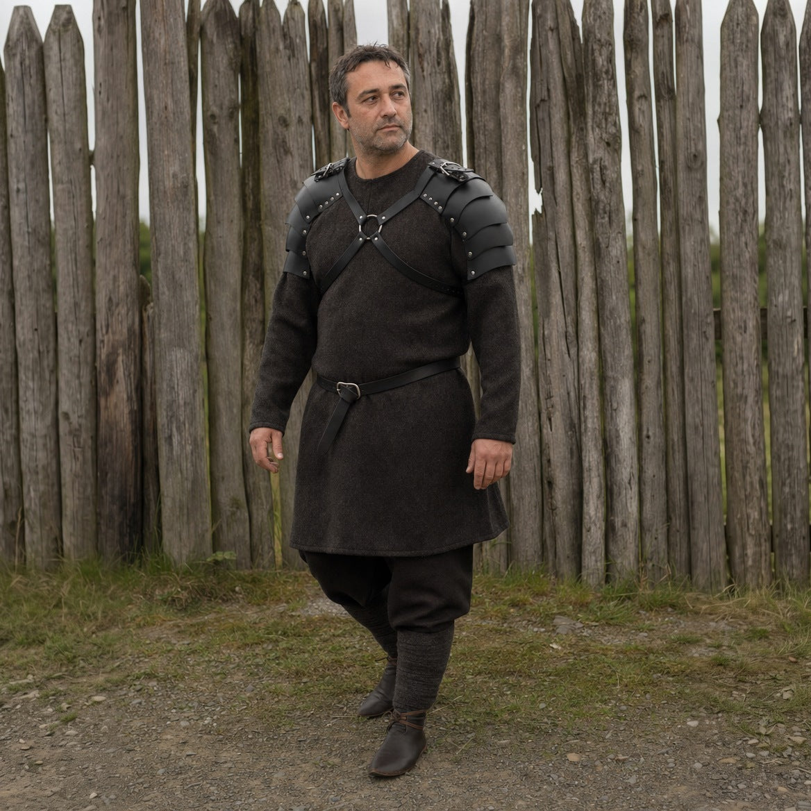 Black double shoulder armour worn outdoors