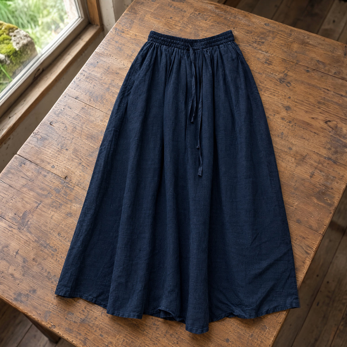 Navy drawstring ramie skirt on a rustic surface