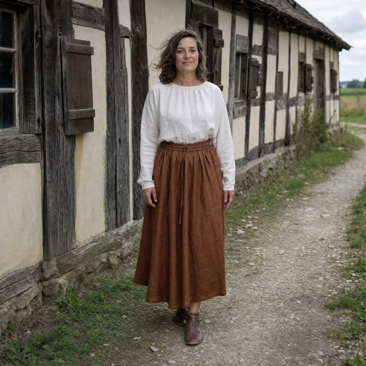 Caramel drawstring ramie skirt worn by a woman outdoors, full-length front view