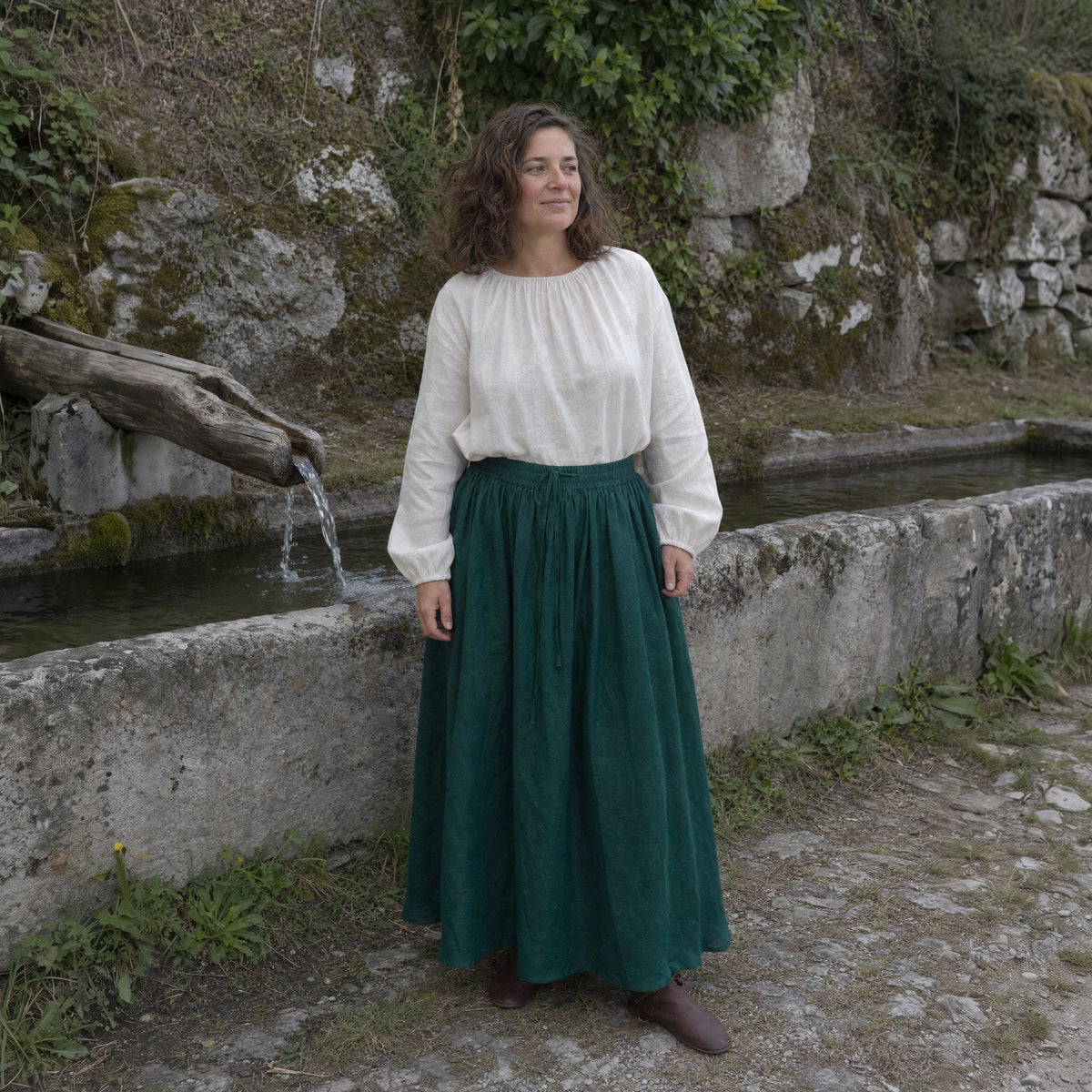 Dark Green drawstring ramie skirt worn by a woman outdoors, full-length front view