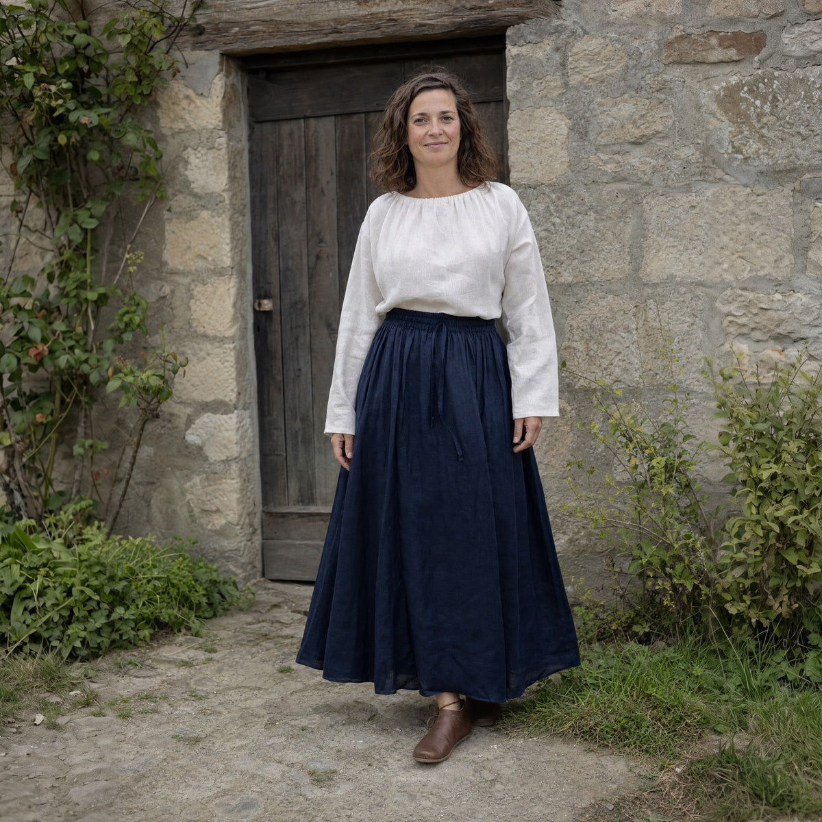 Navy drawstring ramie skirt worn by a woman outdoors, full-length front view