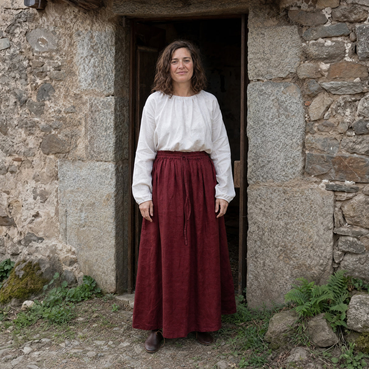 Deep Red drawstring ramie skirt worn by a woman outdoors, full-length front view