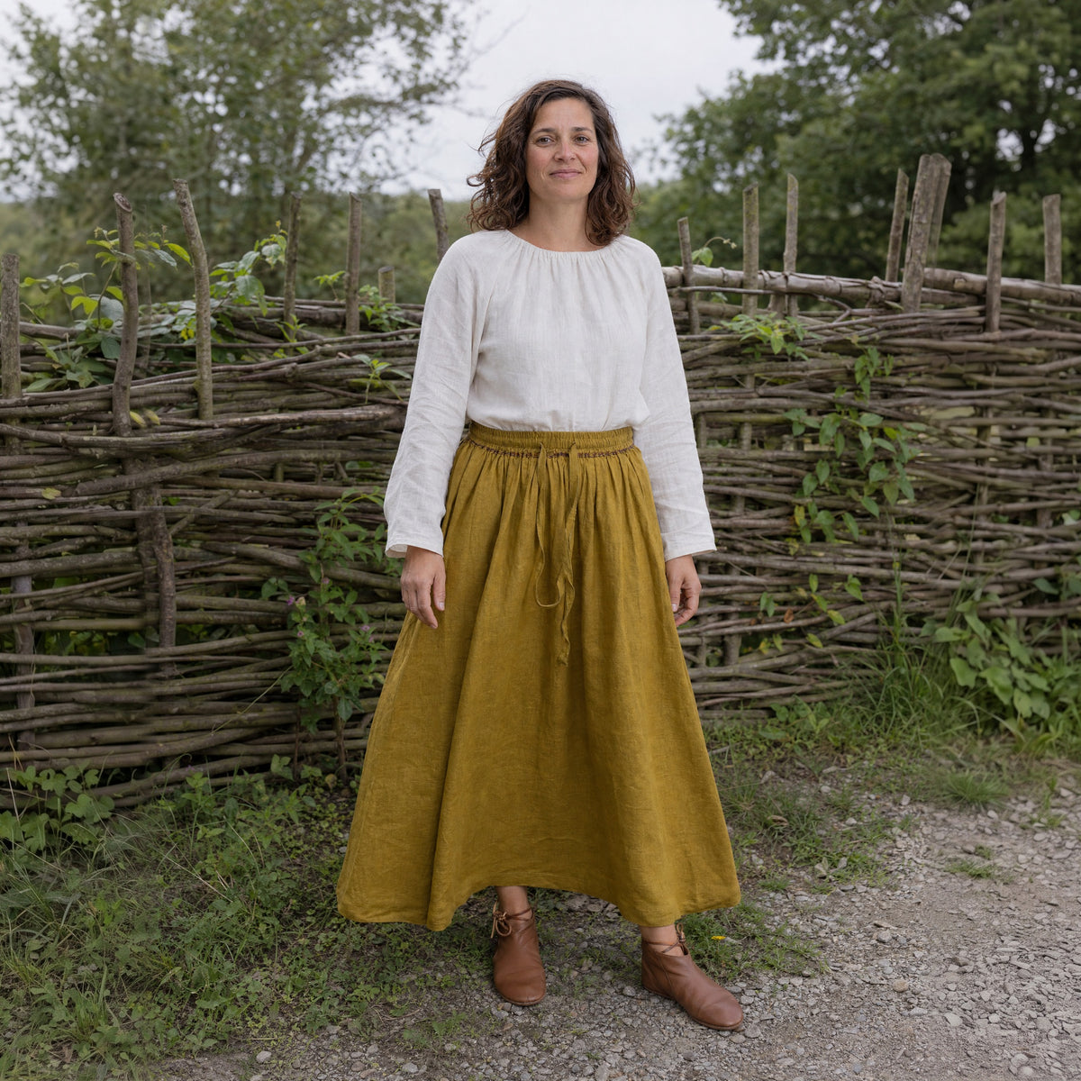 Ginger Yellow drawstring ramie skirt worn by a woman outdoors, full-length front view
