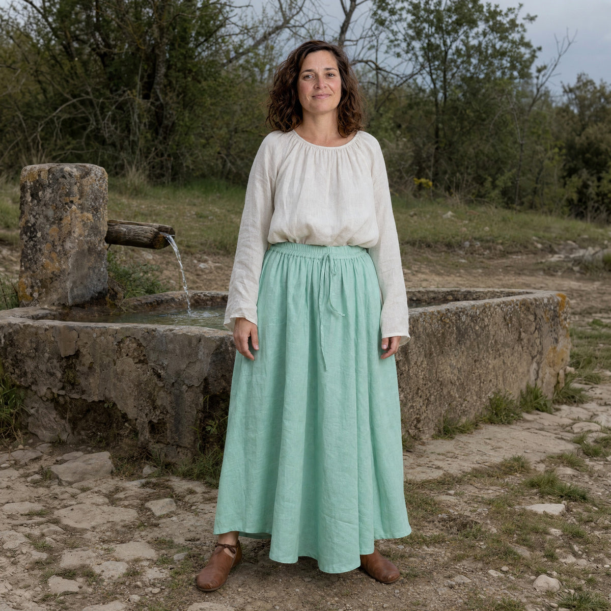 Mint Green drawstring ramie skirt worn by a woman outdoors, full-length front view