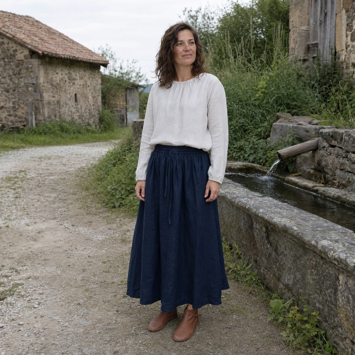 Navy drawstring ramie skirt, three-quarter view of the tied waist