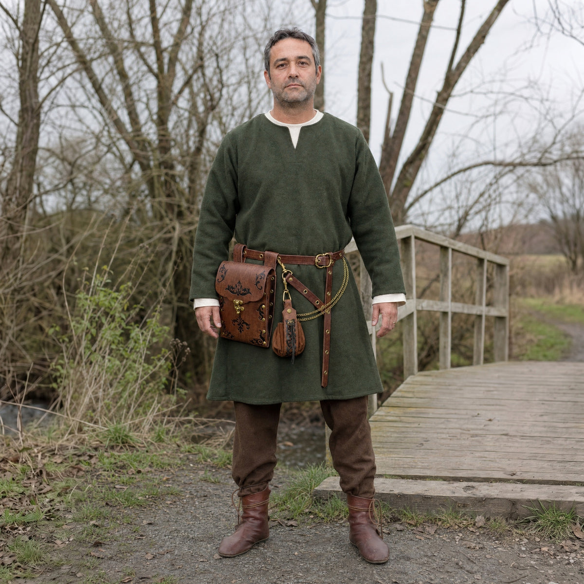 Brown embossed waist bag belt with pouch worn outdoors, full-length front view