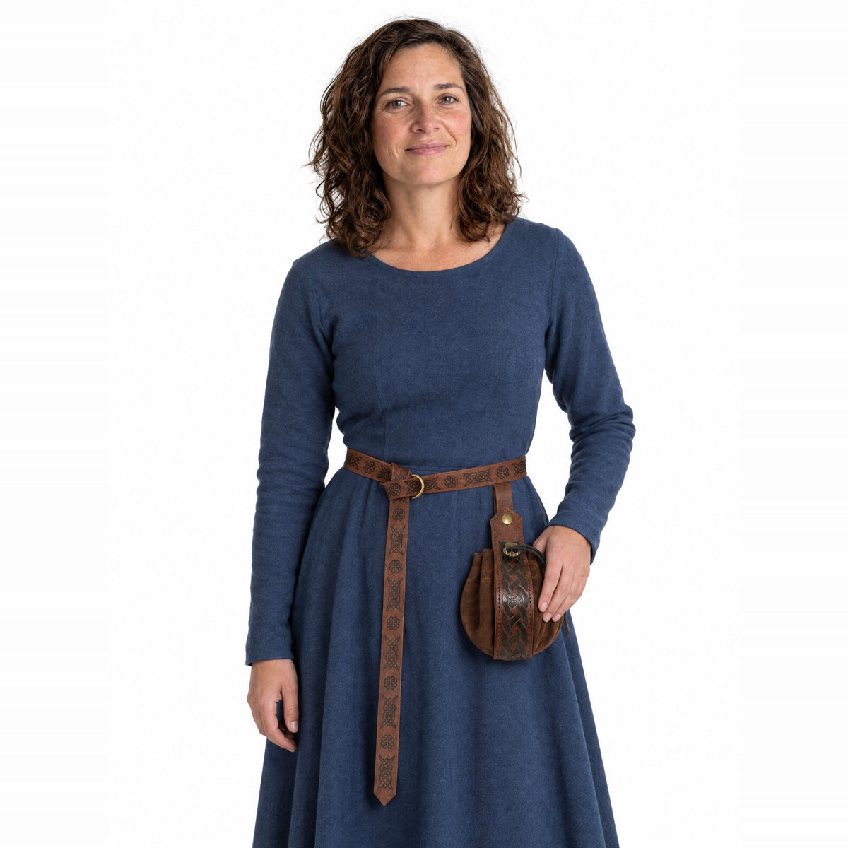 Brown embossed belt with round pouch worn by a model on a white background