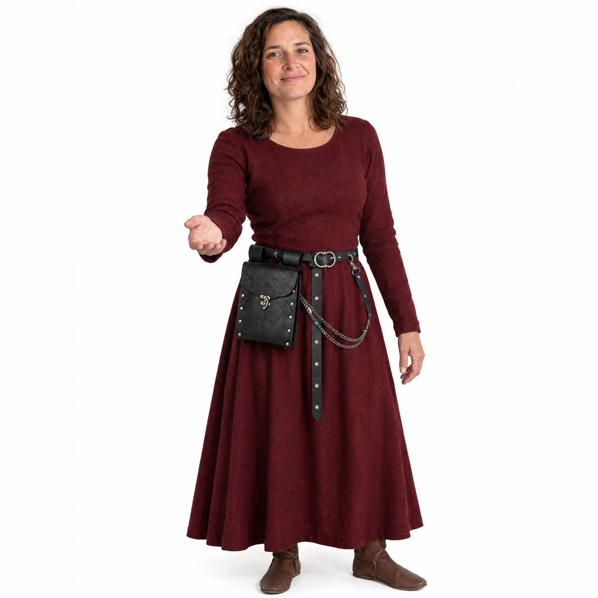 Black embossed waist bag with chain belt worn by a model on a white background