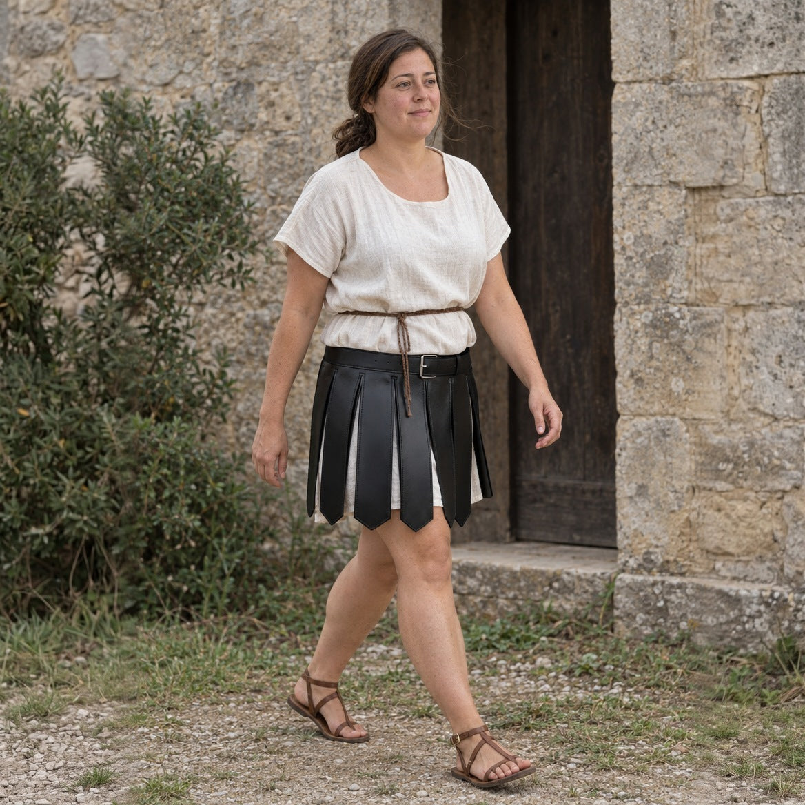 Black faux leather Roman strip skirt worn outdoors