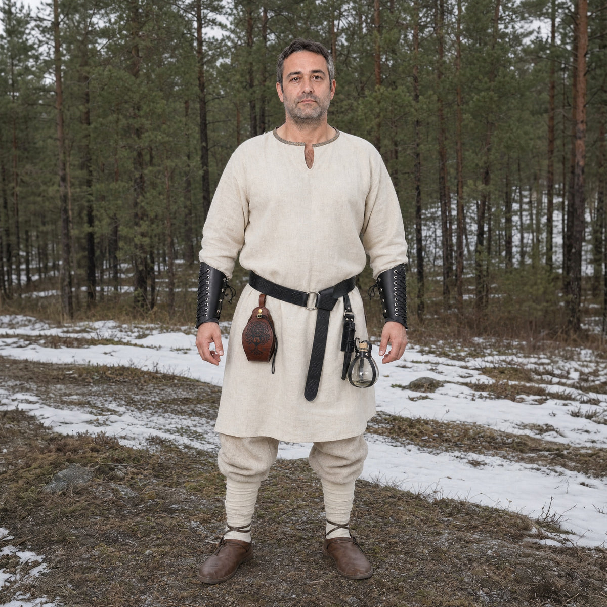 Black five-piece belt kit with bracers worn outdoors, full-length front view