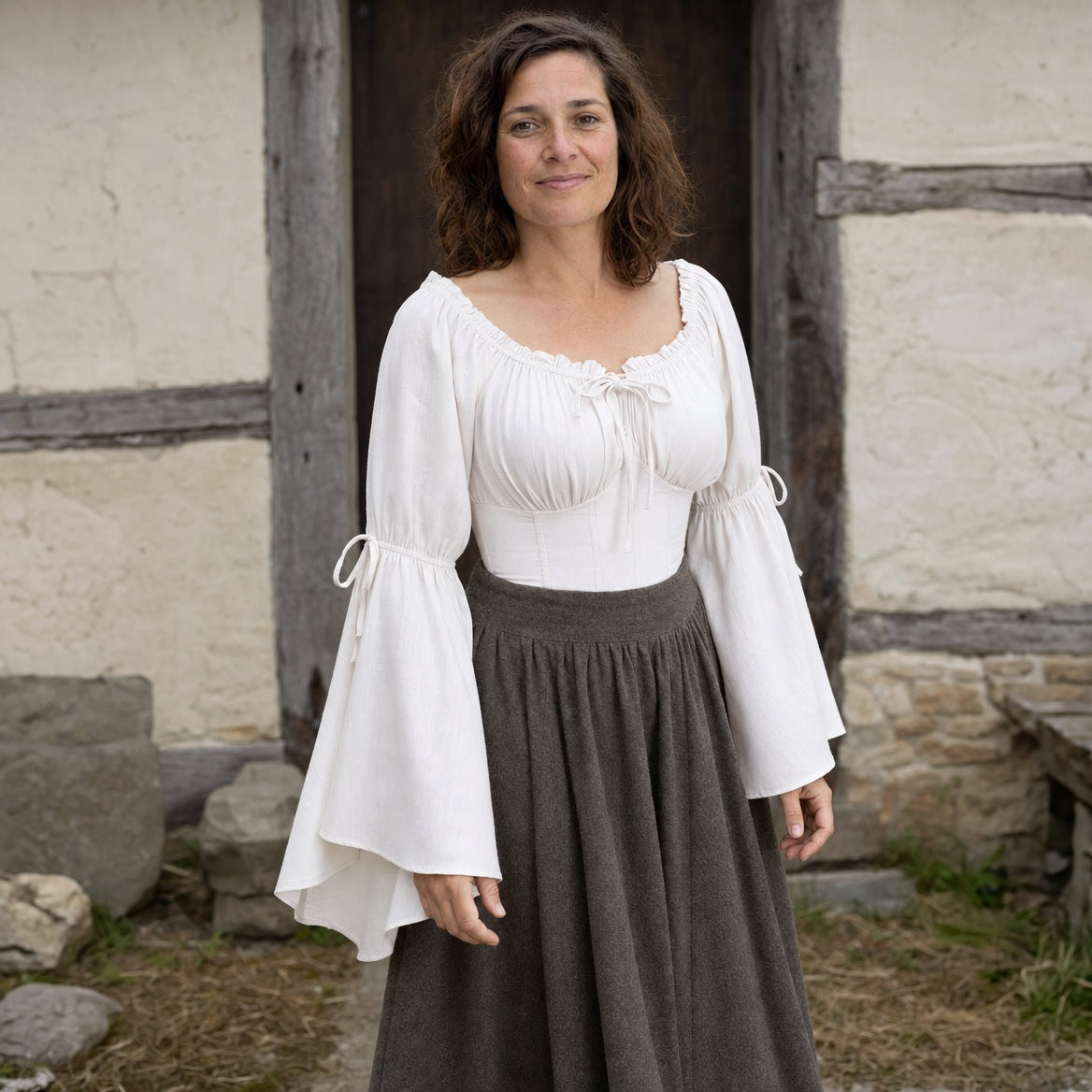 Flared-sleeve Renaissance blouse on a wearer, showing the sleeve length and fitted waist
