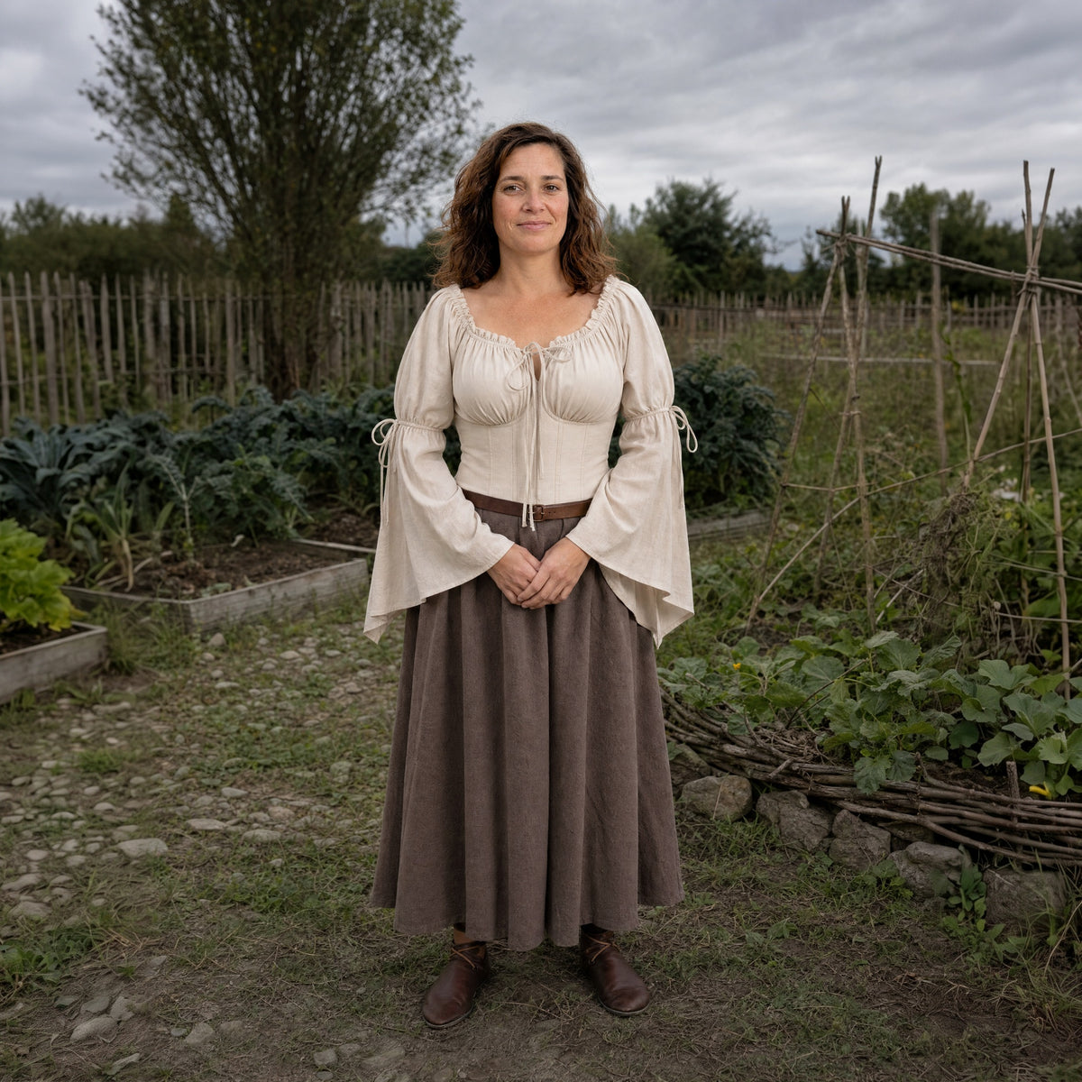 Beige flared-sleeve Renaissance blouse worn by a woman outdoors, full-length front view
