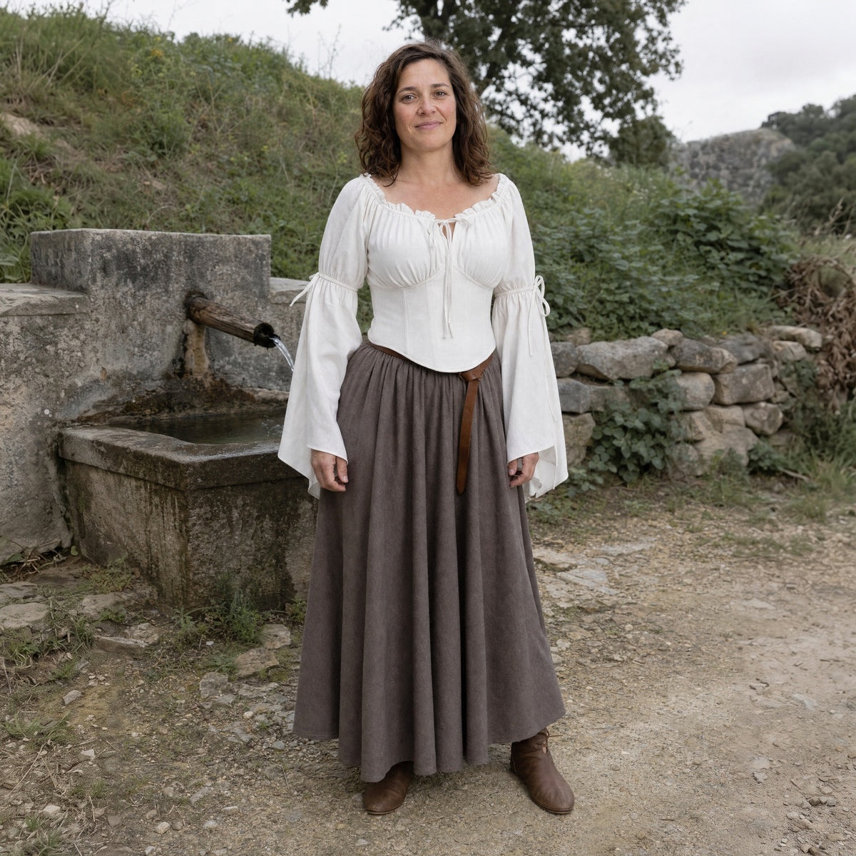 White flared-sleeve Renaissance blouse worn by a woman outdoors, full-length front view