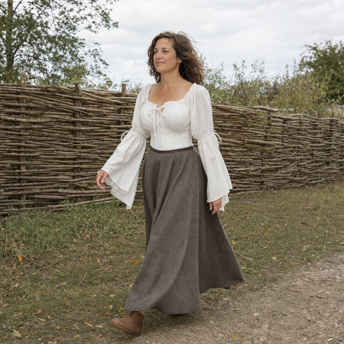 White flared-sleeve Renaissance blouse worn outdoors