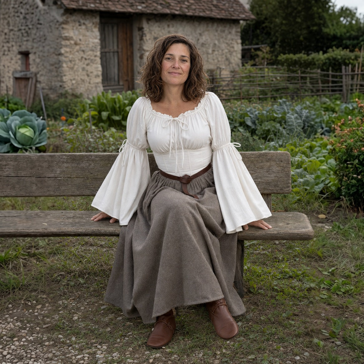 Flared-sleeve Renaissance blouse styled with a long skirt and a wide belt