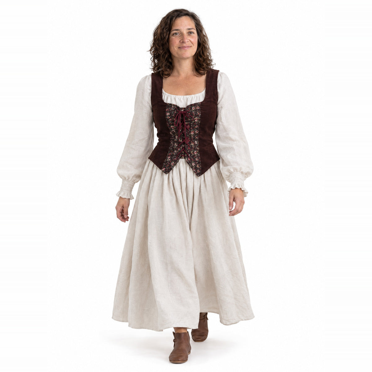 Full-skirt dress and laced vest set worn by a model on a white background