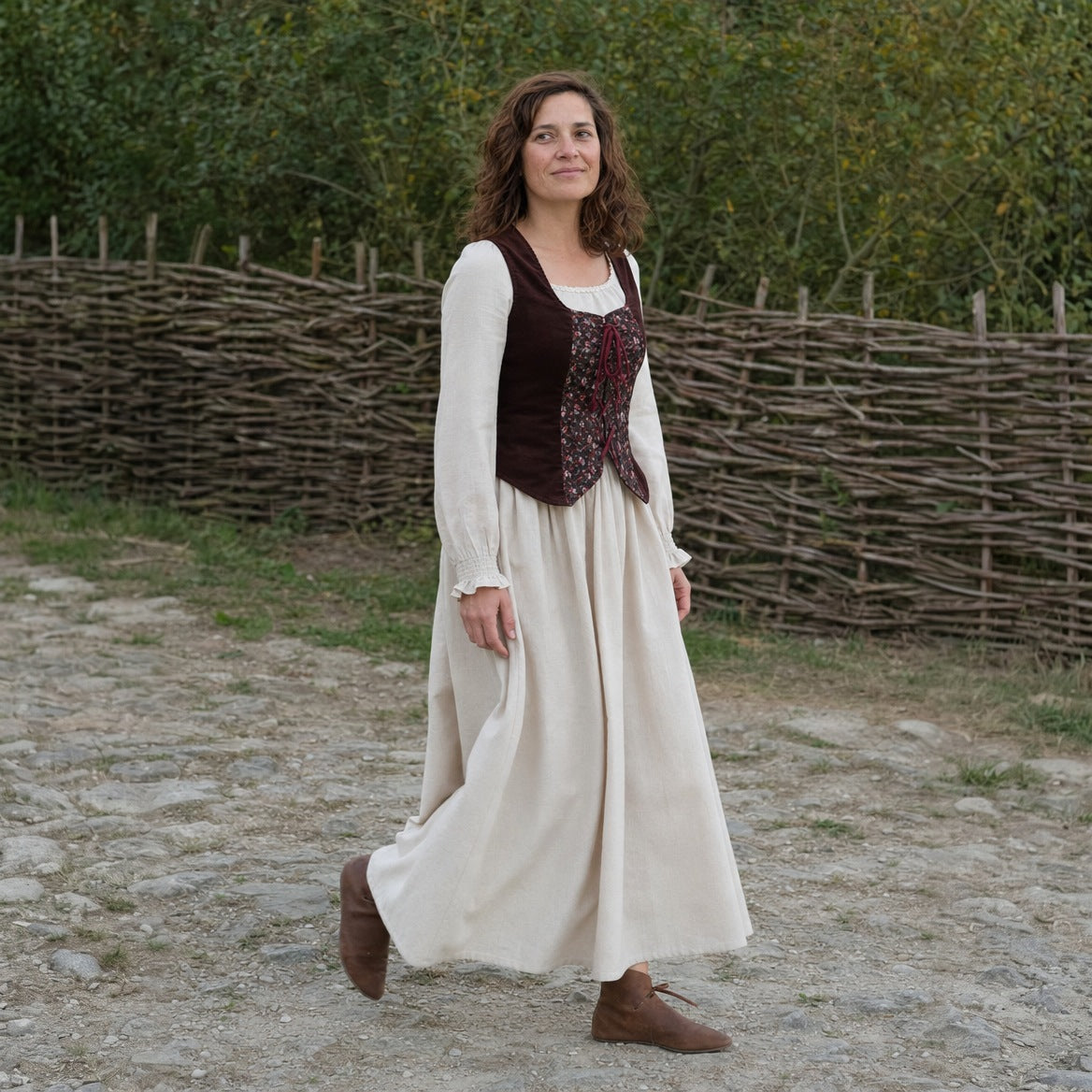 Full-skirt dress and laced vest set worn outdoors