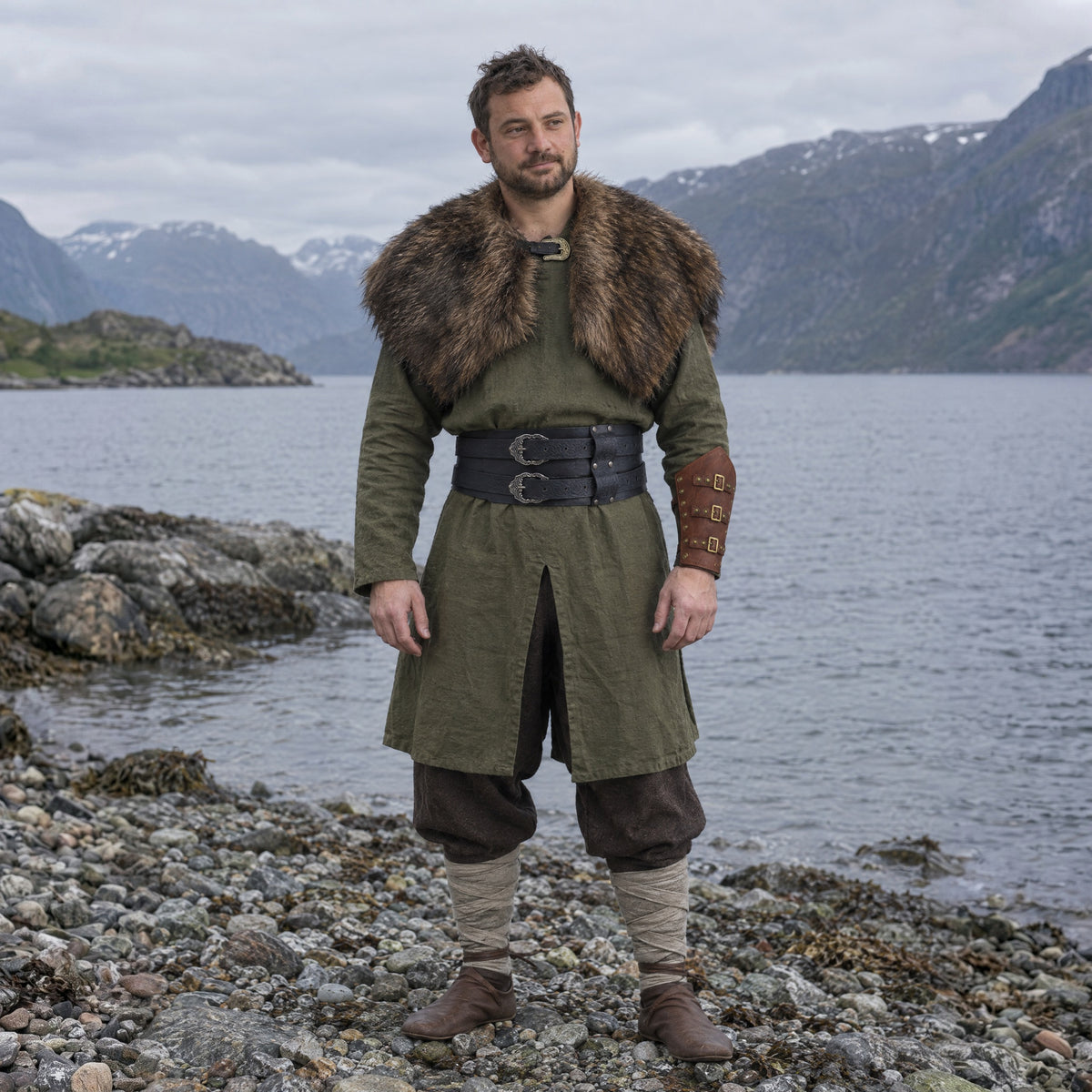 Gold-Stud Pentagon Bracer in a complete Viking outfit, worn by a man outdoors