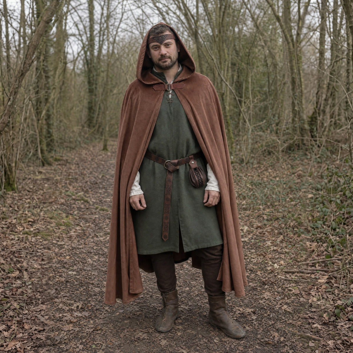 Brown hooded cloak with belt and pouch worn outdoors, full-length front view