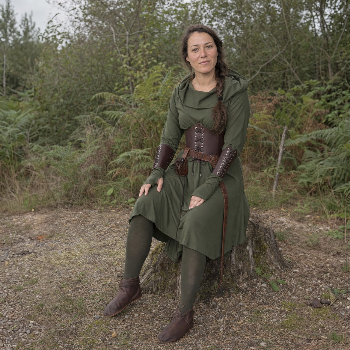 Hooded elf dress styled with a corset belt and boots