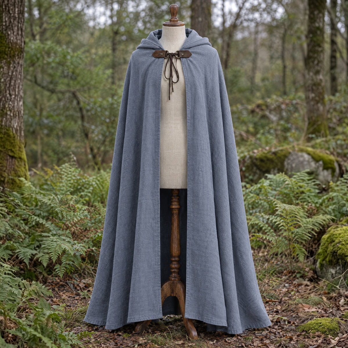 Grey hooded ranger cloak on a dress form outdoors