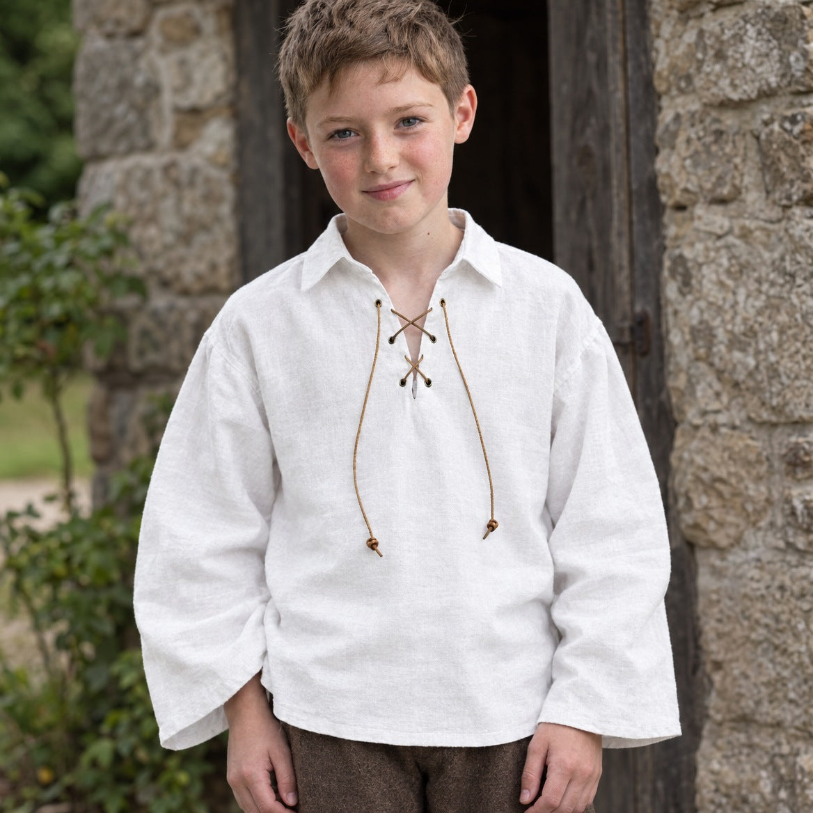 Kids' lace-up renaissance shirt on a child, showing the fit