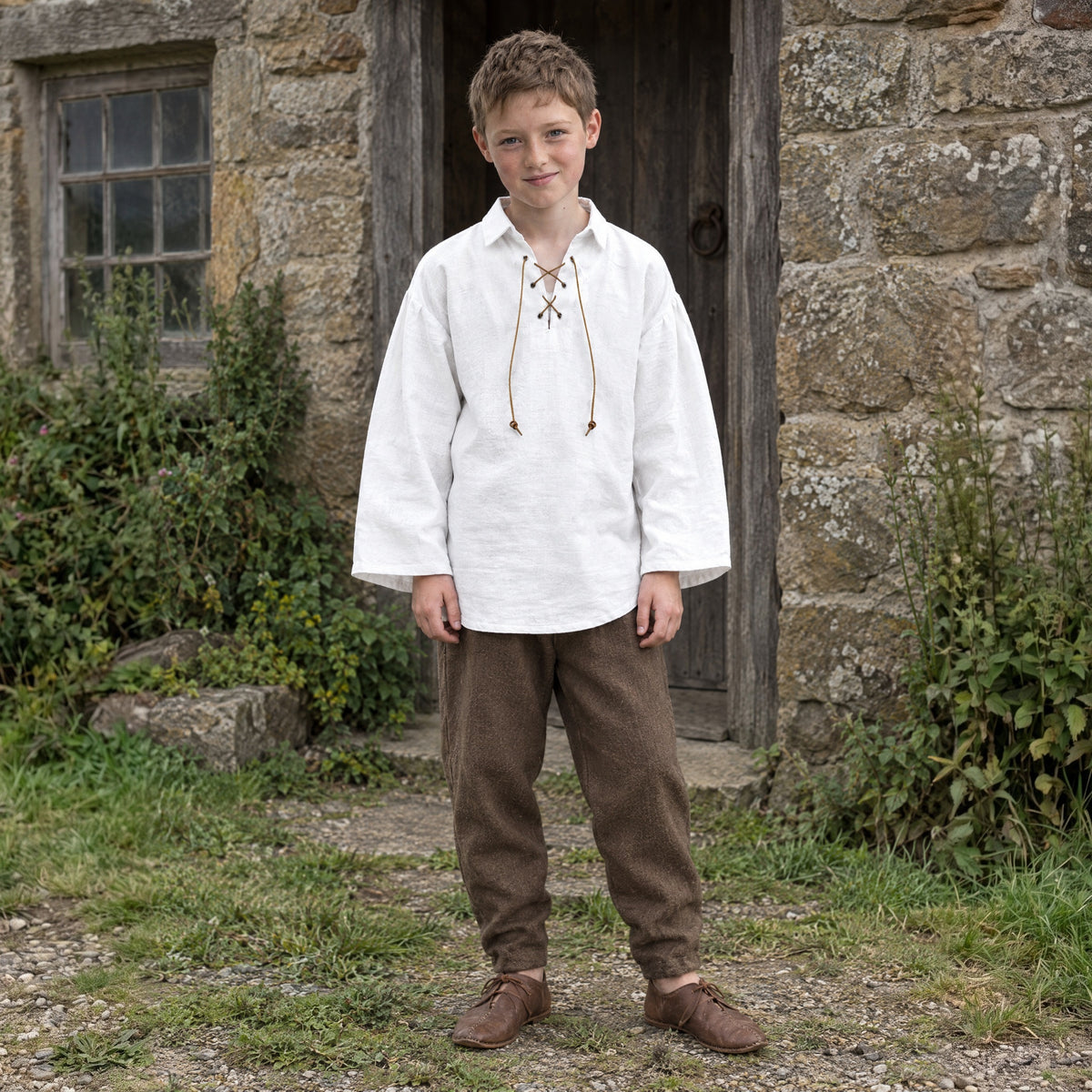 White kids' lace-up renaissance shirt worn by a child outdoors, full-length front view
