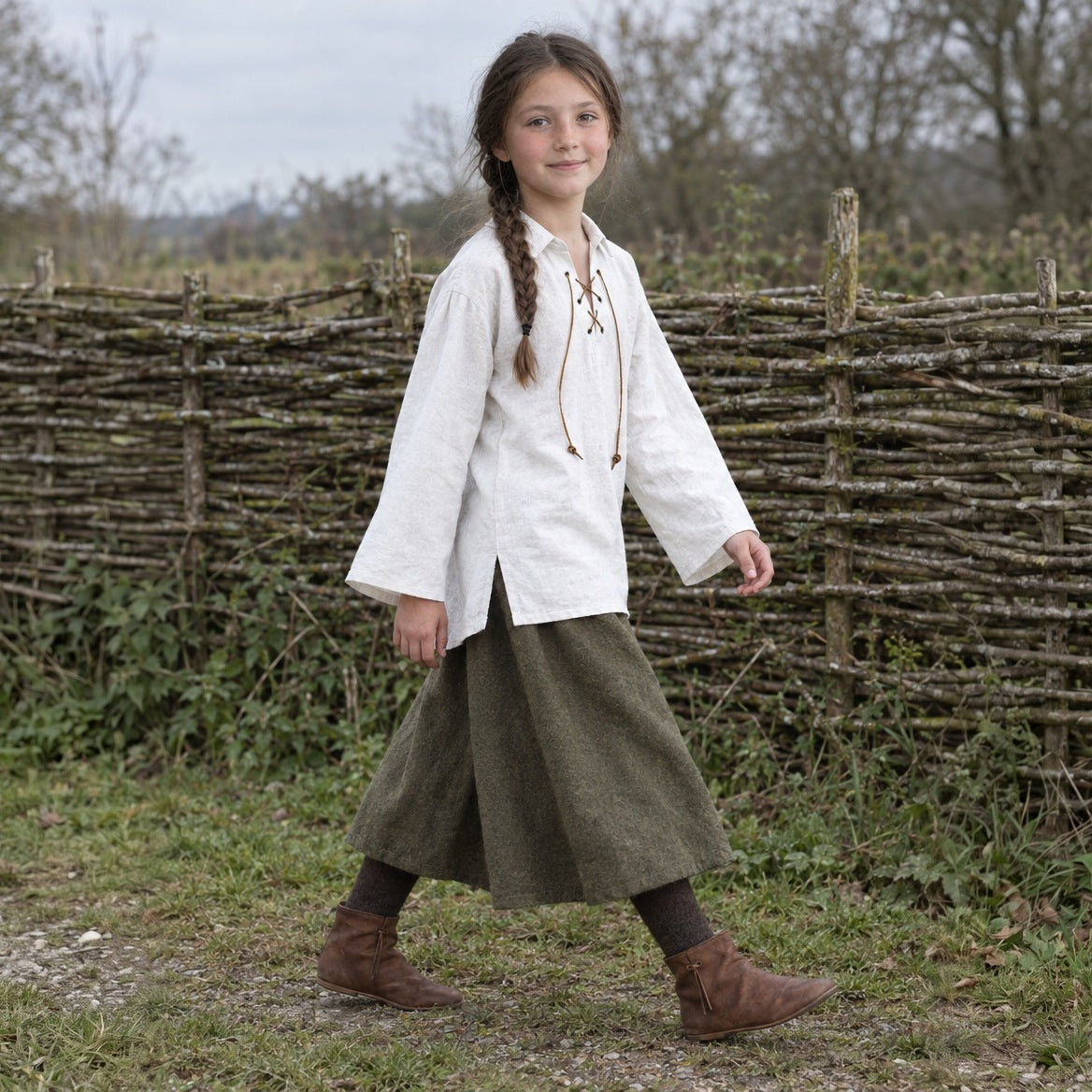White kids' lace-up renaissance shirt worn outdoors