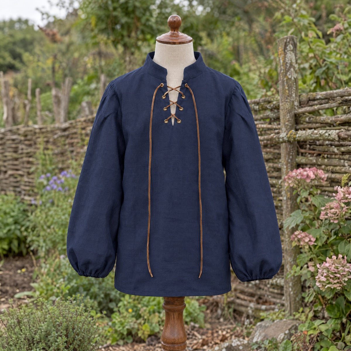 Navy kids' stand-collar shirt on a dress form outdoors