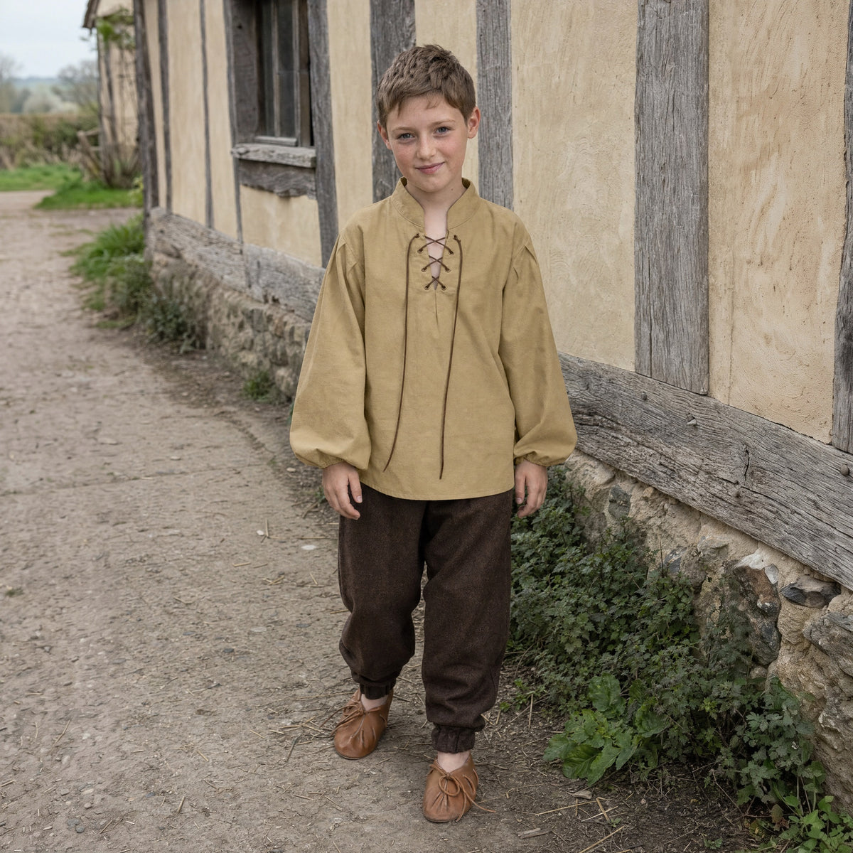 Khaki kids' stand-collar shirt worn by a child outdoors, full-length front view