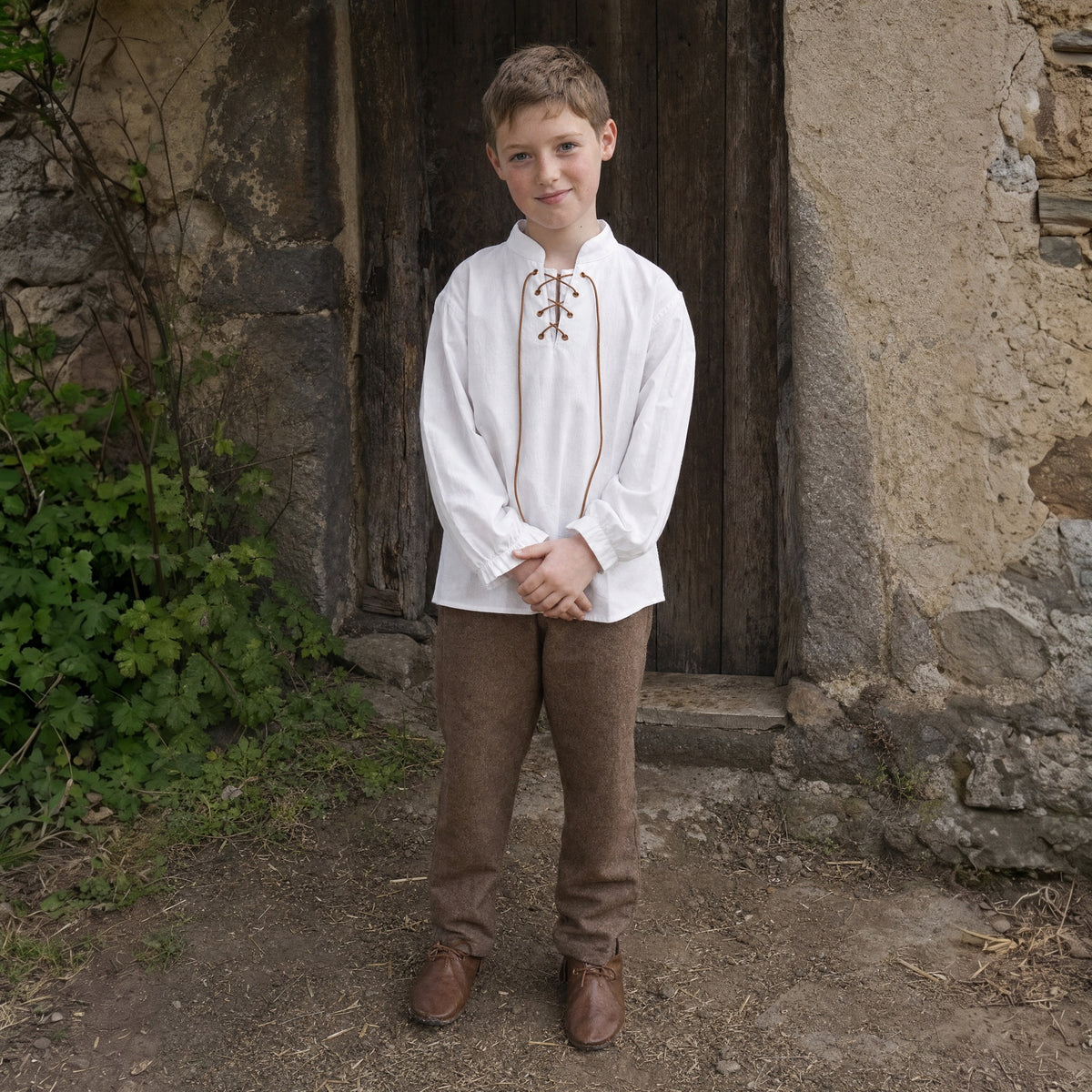 White kids' stand-collar shirt worn by a child outdoors, full-length front view