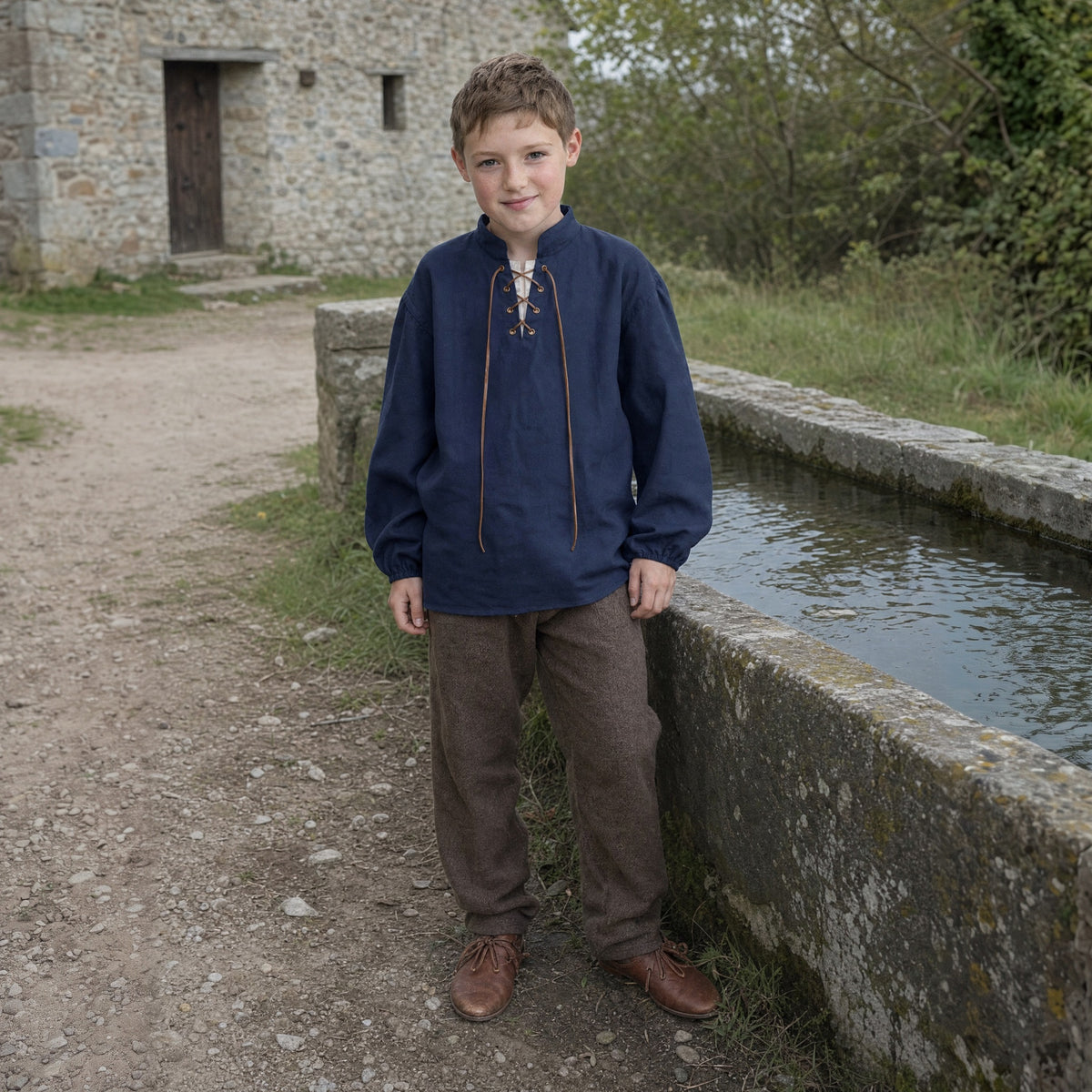 Navy kids' stand-collar shirt worn by a child outdoors, full-length front view