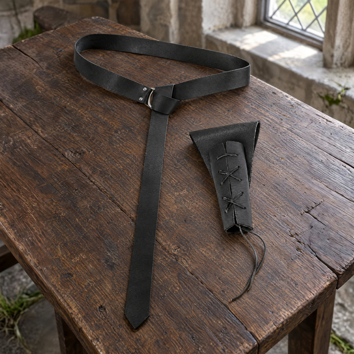 Black knight belt with sword frog on a rustic surface