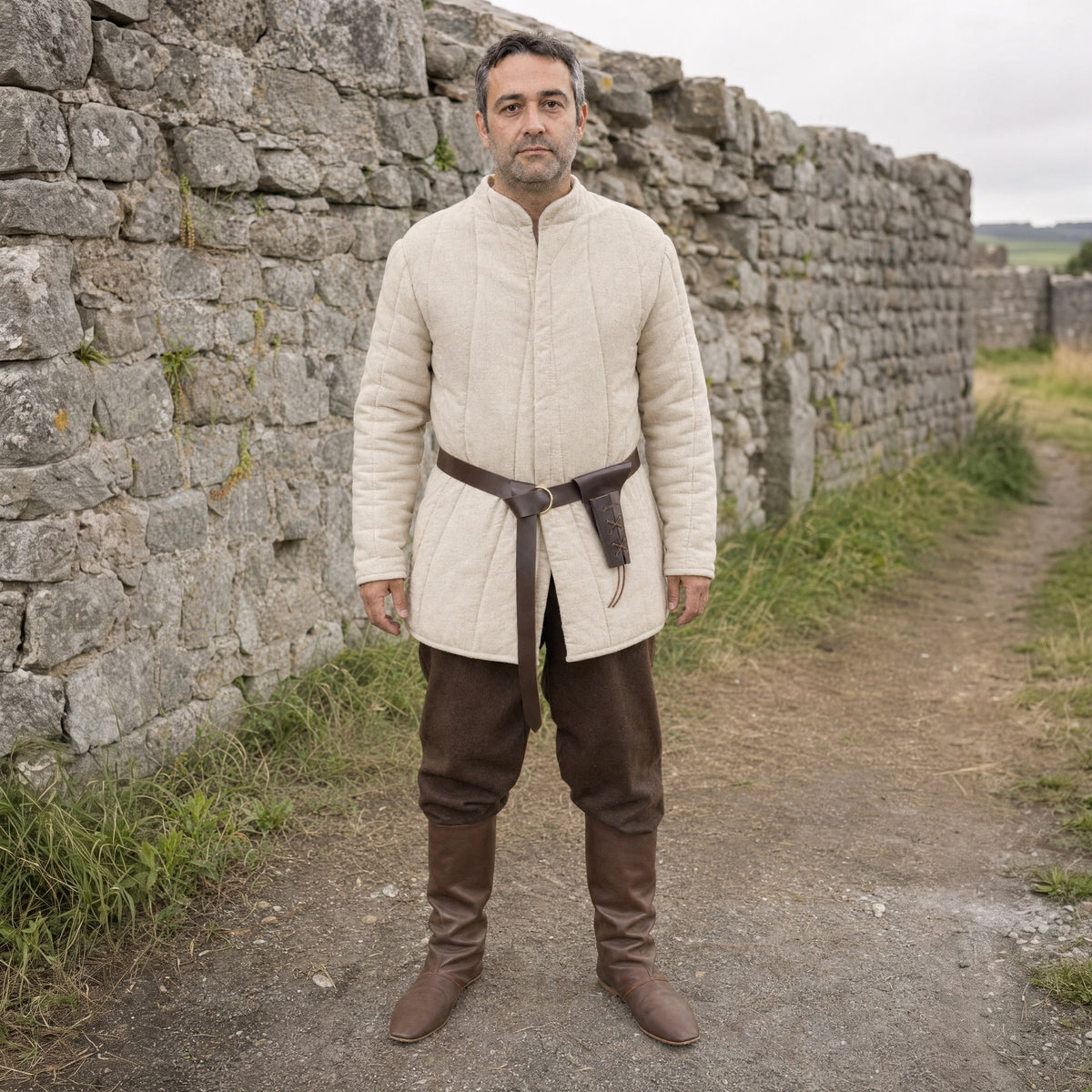 Brown knight belt with sword frog worn outdoors, full-length front view