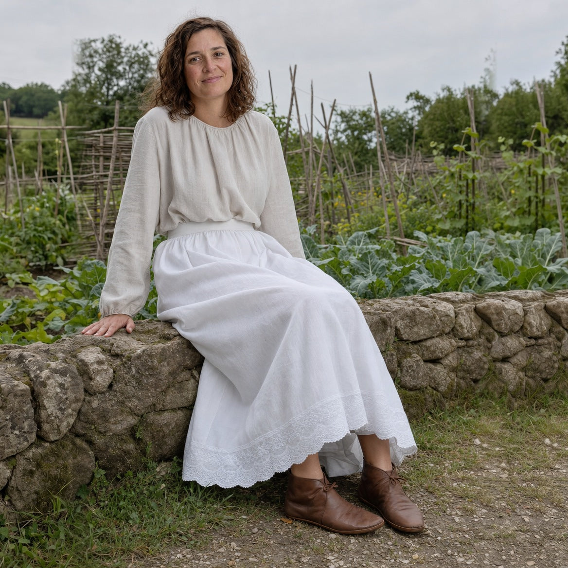 Lace-hem cotton petticoat worn with a cream blouse and ankle boots