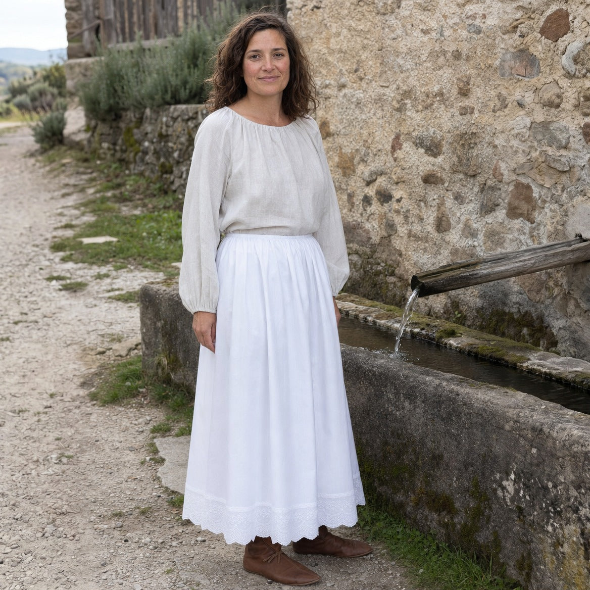 White lace-hem cotton petticoat, three-quarter view of the lace hem