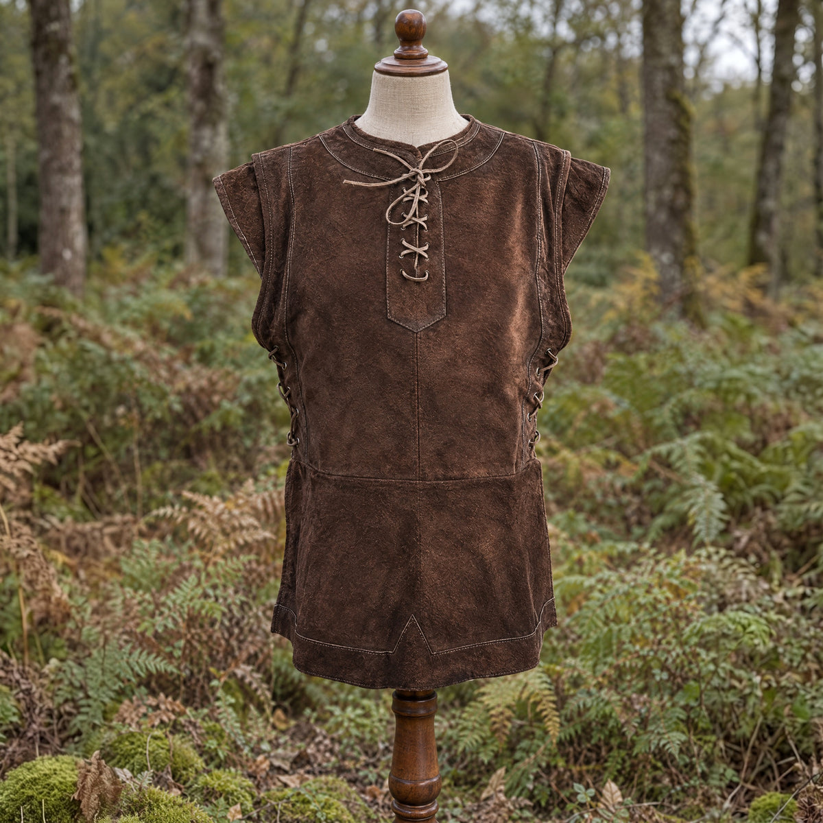 Brown lace-up hunter vest on a dress form outdoors