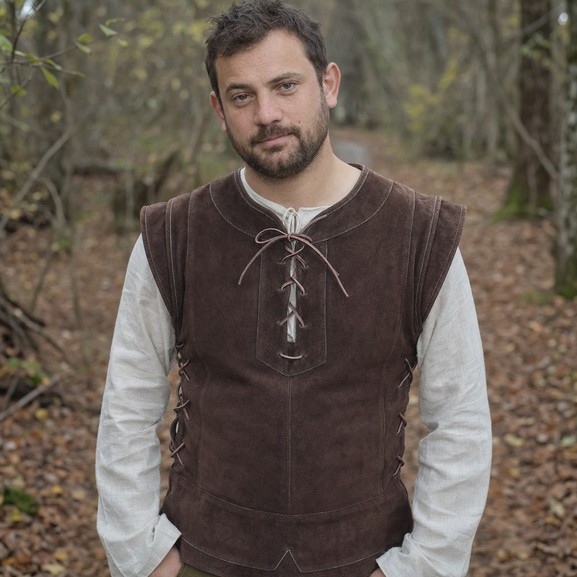 Lace-up hunter vest on a wearer, showing the fit over a long-sleeve shirt