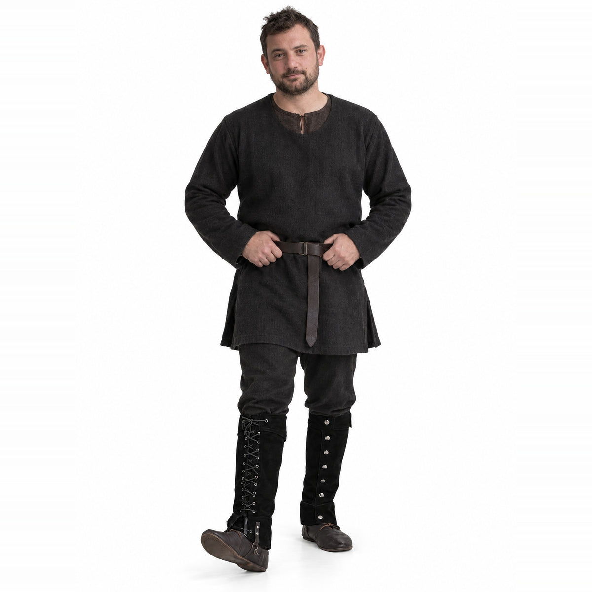 Black lace-up studded gaiters worn by a model on a white background