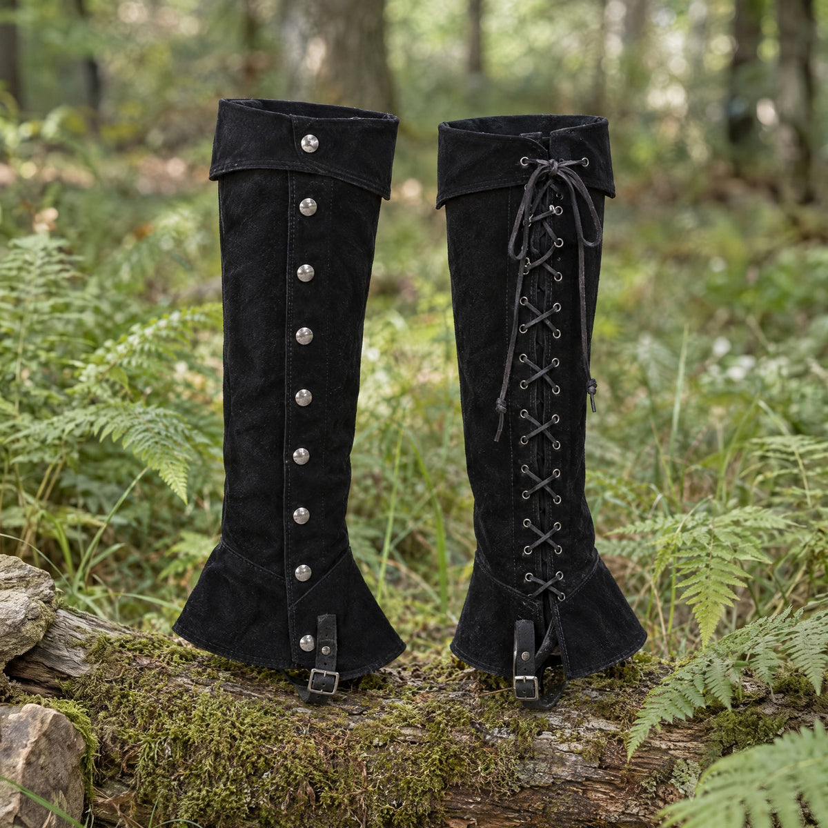 Black lace-up studded gaiters on a rustic surface