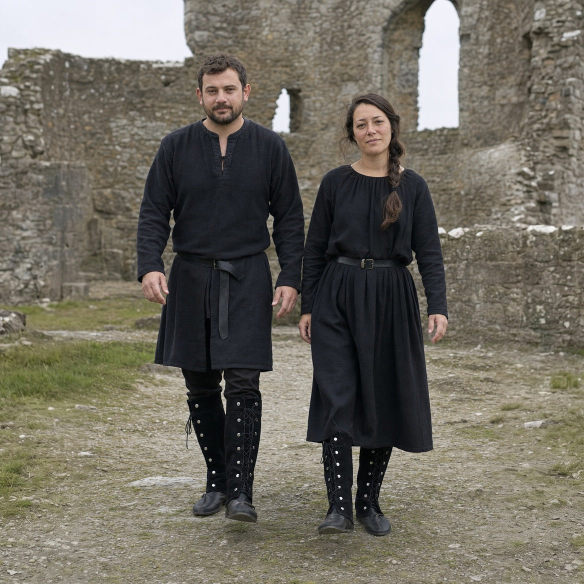 Lace-up studded gaiters styled over plain boots with trousers and a tunic