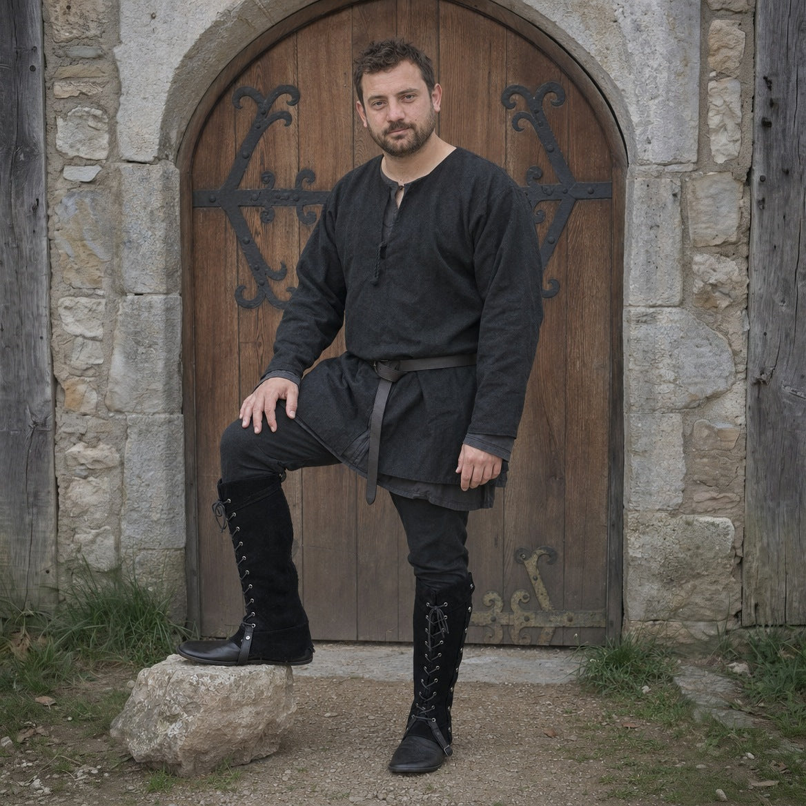 Black lace-up studded gaiters, three-quarter view of the lacing and studs