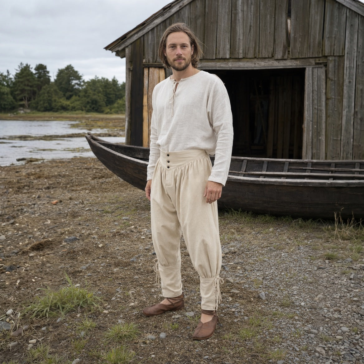 Off-White laced trousers, three-quarter view of the eyelet lacing and ankle ties
